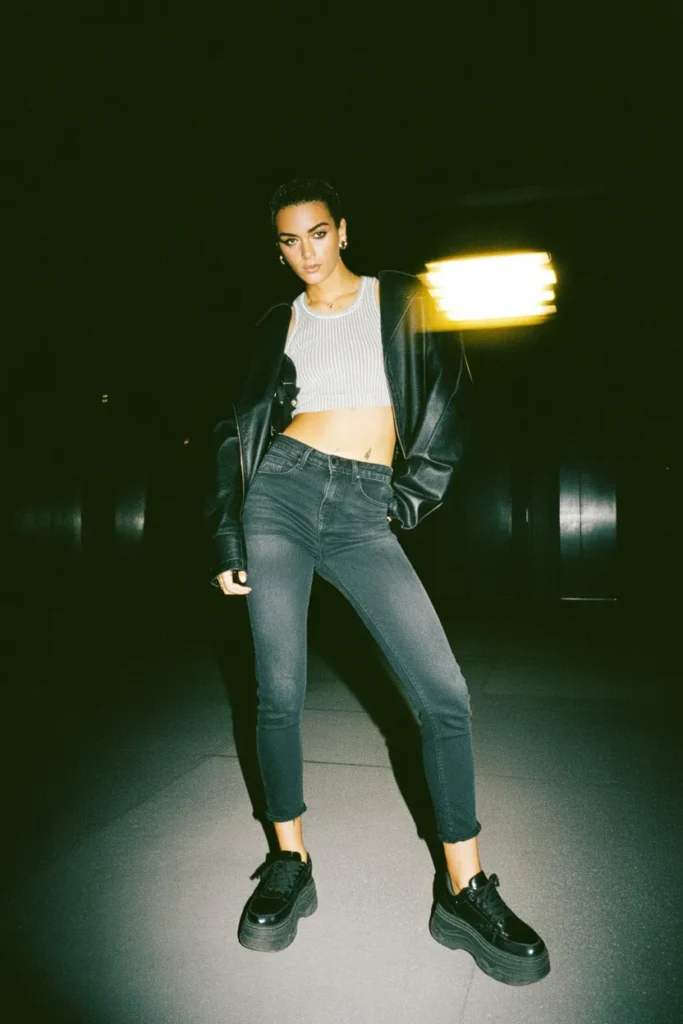 Chunky black platform sneakers indie sleaze outfit with skinny jeans and leather jacket